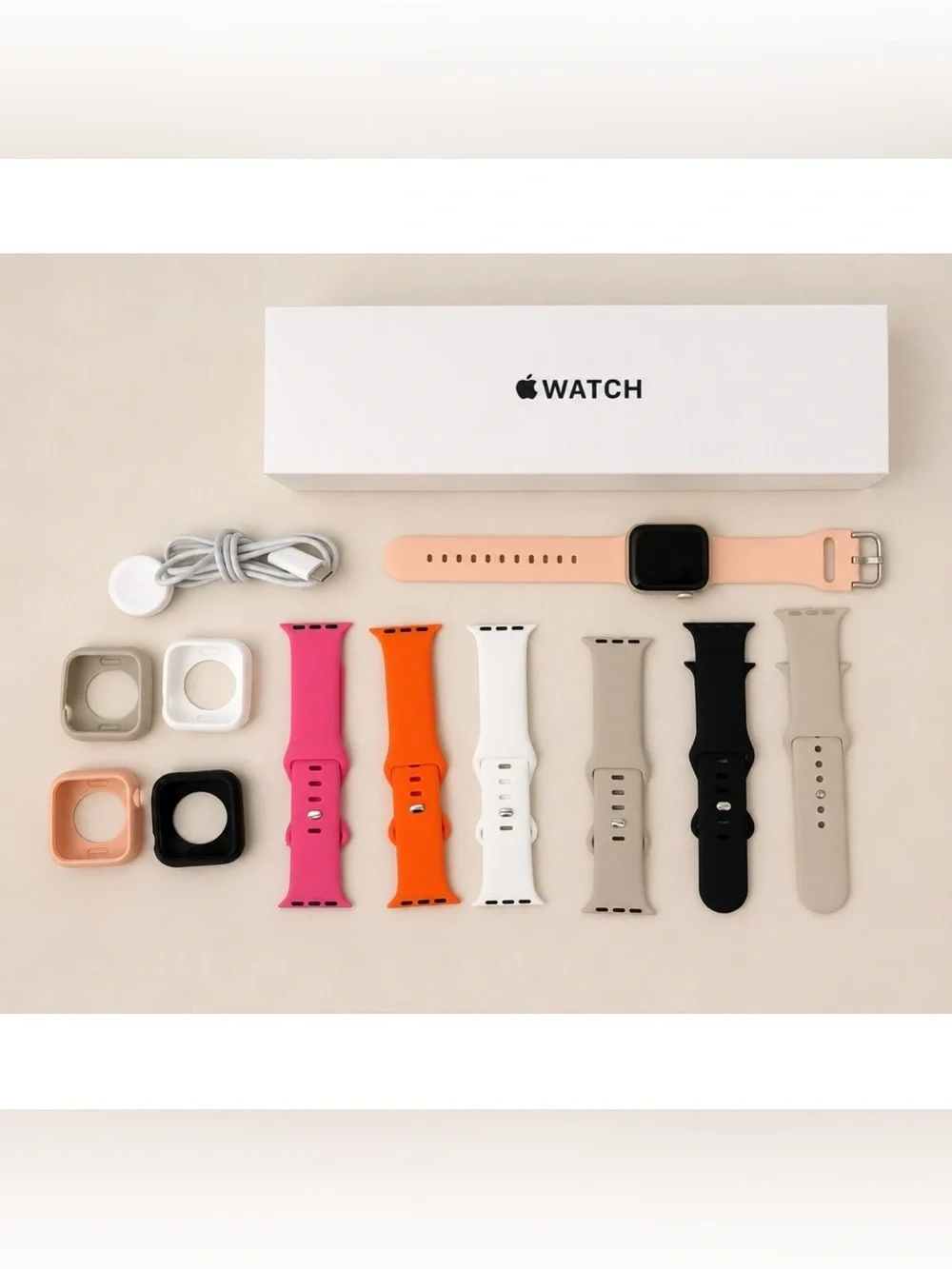 Apple Watch with Pink Sport Band and Multi-Color Interchangeable Bands